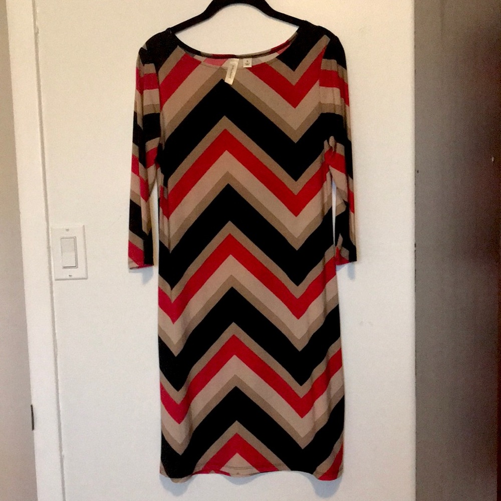 Knee length red, black, cream, and nude dress